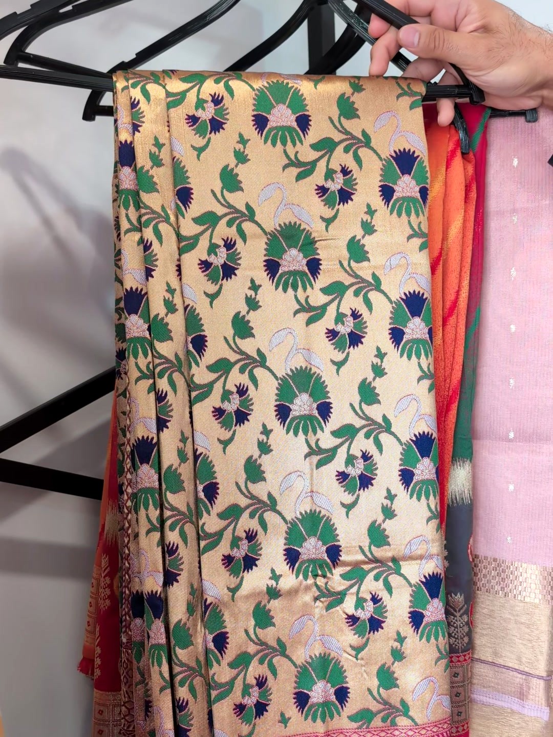Cream woven saree with green and navy floral jaal and pink border