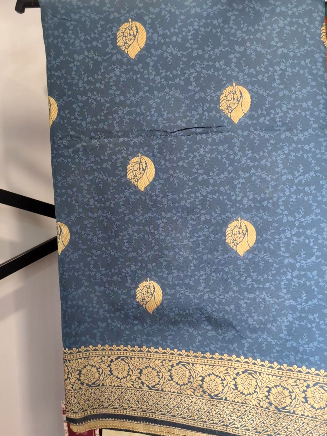 Steel blue woven saree with gold paisley buttis and zari border